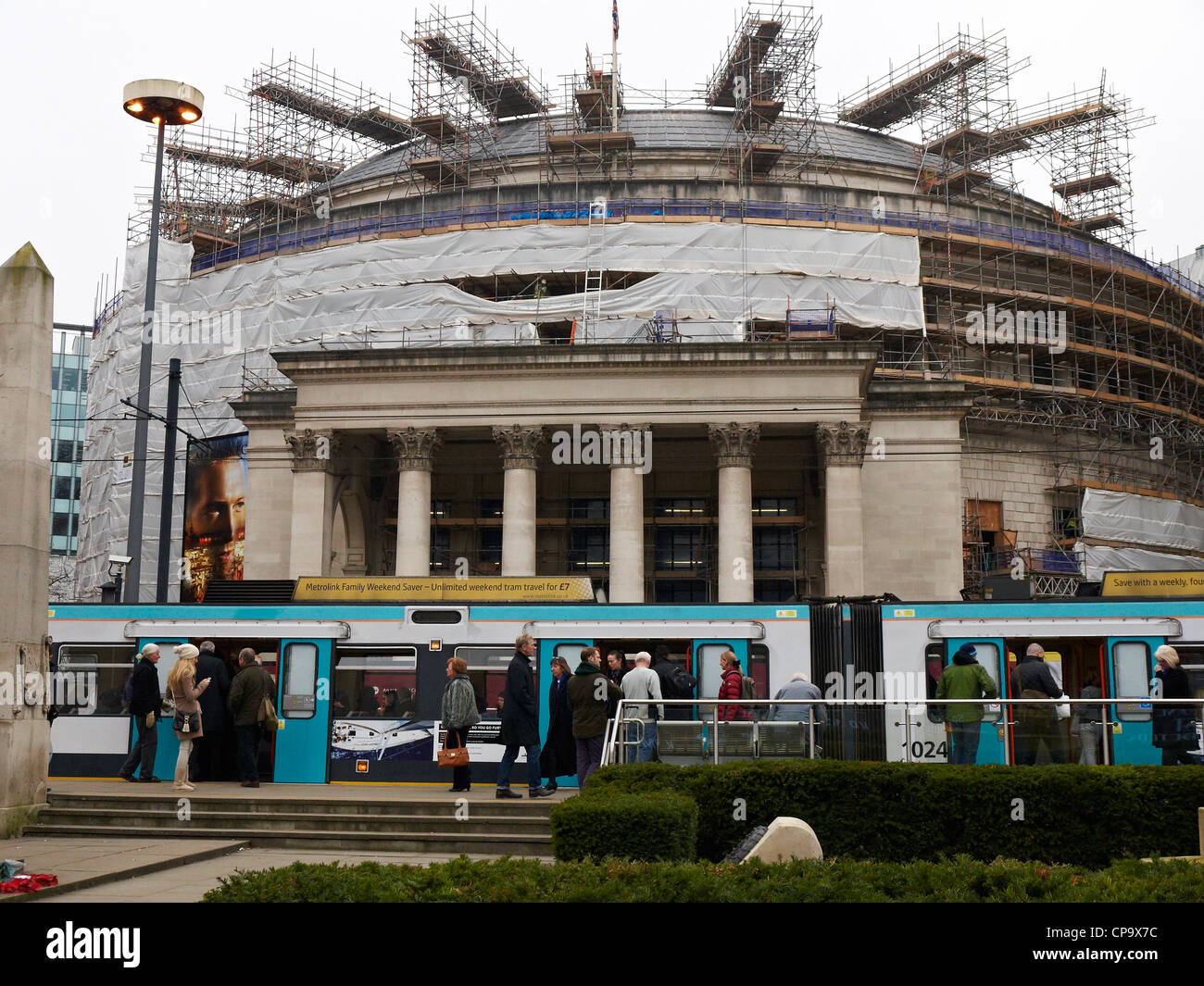 Central library undergoing renovation on St Peter`s Square with tram in Manchester UK Stock Photo